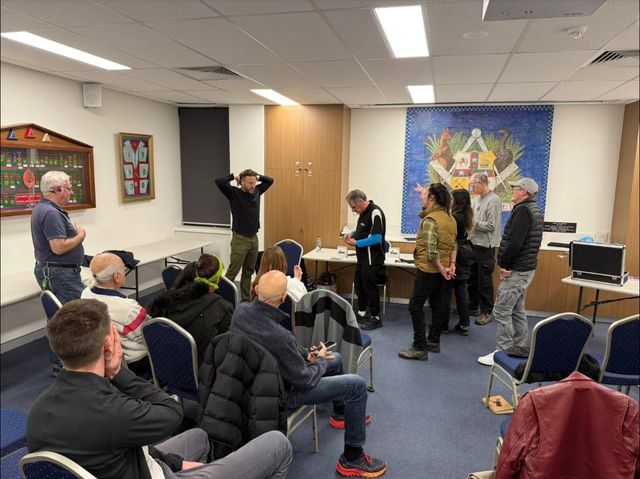 Audience volunteers on their feet during the Eric Leclerc lecture at the Freemasons building, Subiaco