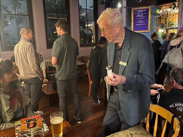 Ian Moffat (name badge) performing in the Blue Room Theatre bar